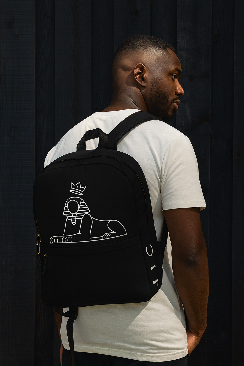 Crown Backpack worn over a white tee — white crowned Sphinx print