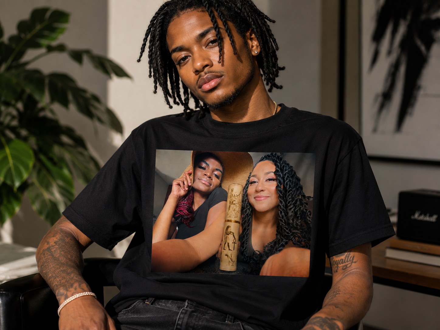 Velvet Ritual Session Tee in black, worn — two queens with the gold Egyptian scroll printed across the chest