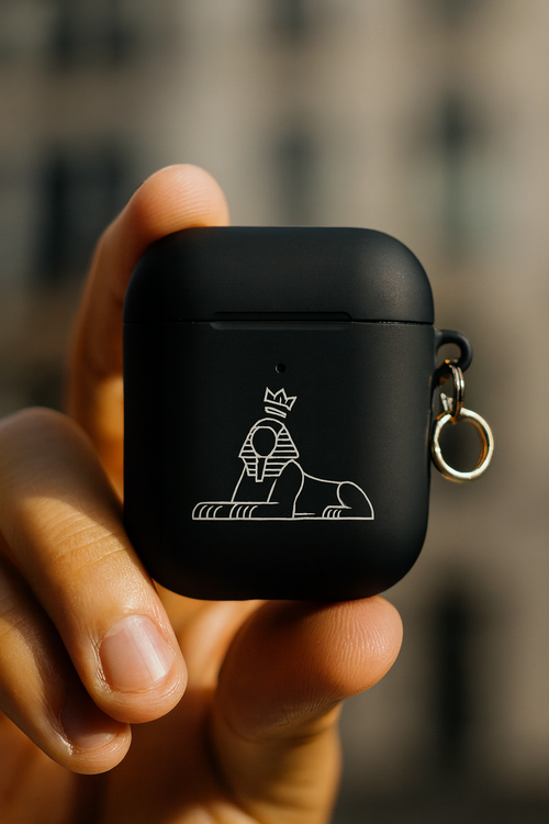 BLACK MAJIC AirPods case held in hand