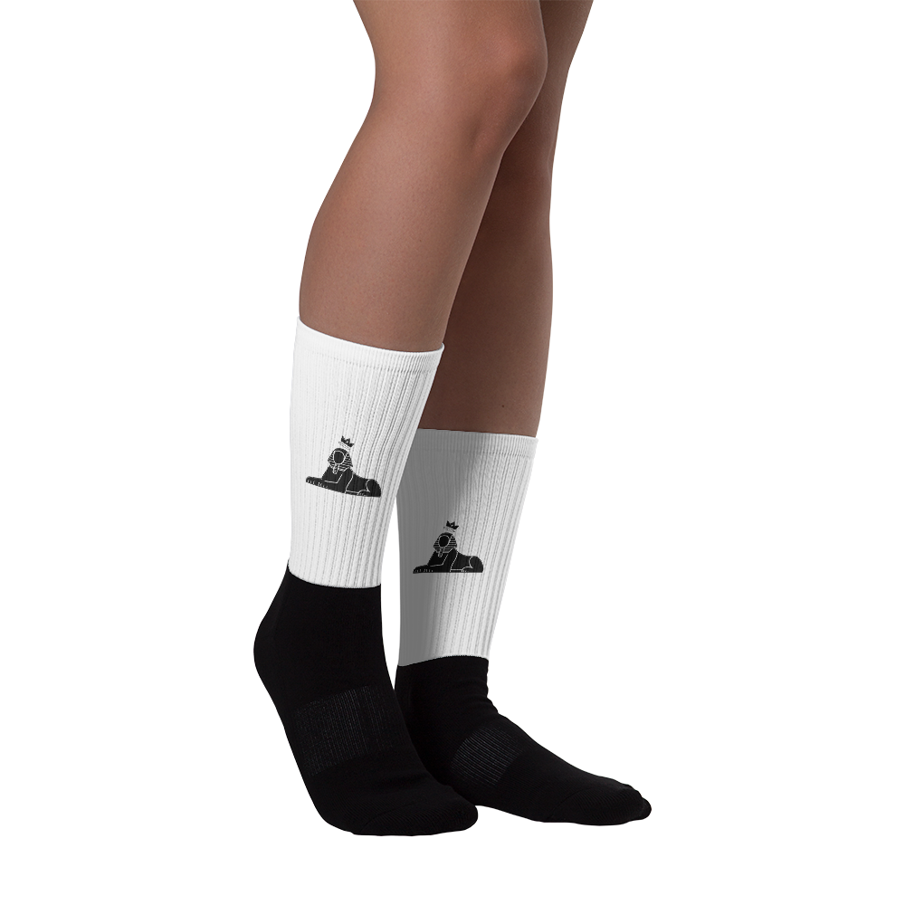 BLACK MAJIC Crown Socks in white worn, side view with the black sphinx mark