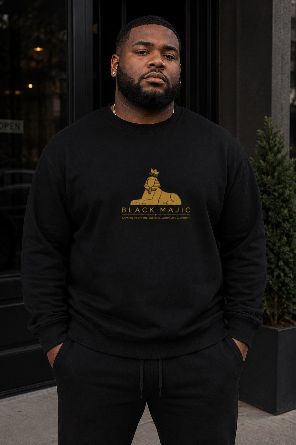 BLACK MAJIC Crown Crewneck — Everyday in black, gold crowned Sphinx over the wordmark and tagline