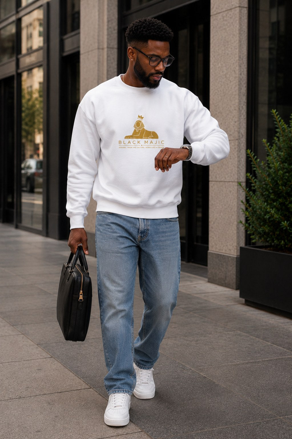 BLACK MAJIC Crown Crewneck — Everyday in white, gold crowned Sphinx over the wordmark and tagline, worn on the street