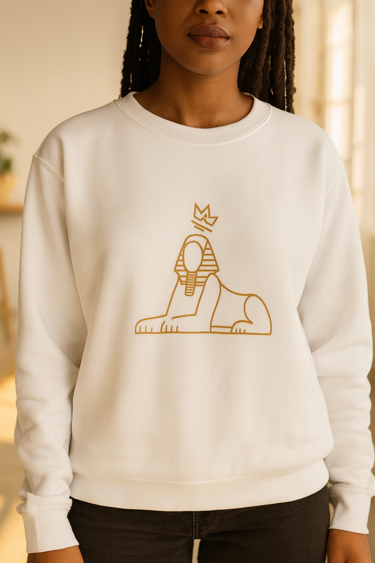 Black woman in the BLACK MAJIC Embroidered Crewneck, white with gold sphinx, bright loft