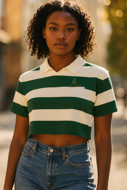 Black woman wearing the BLACK MAJIC Women's Rugby Crop Tee, green and cream stripes with gold crest
