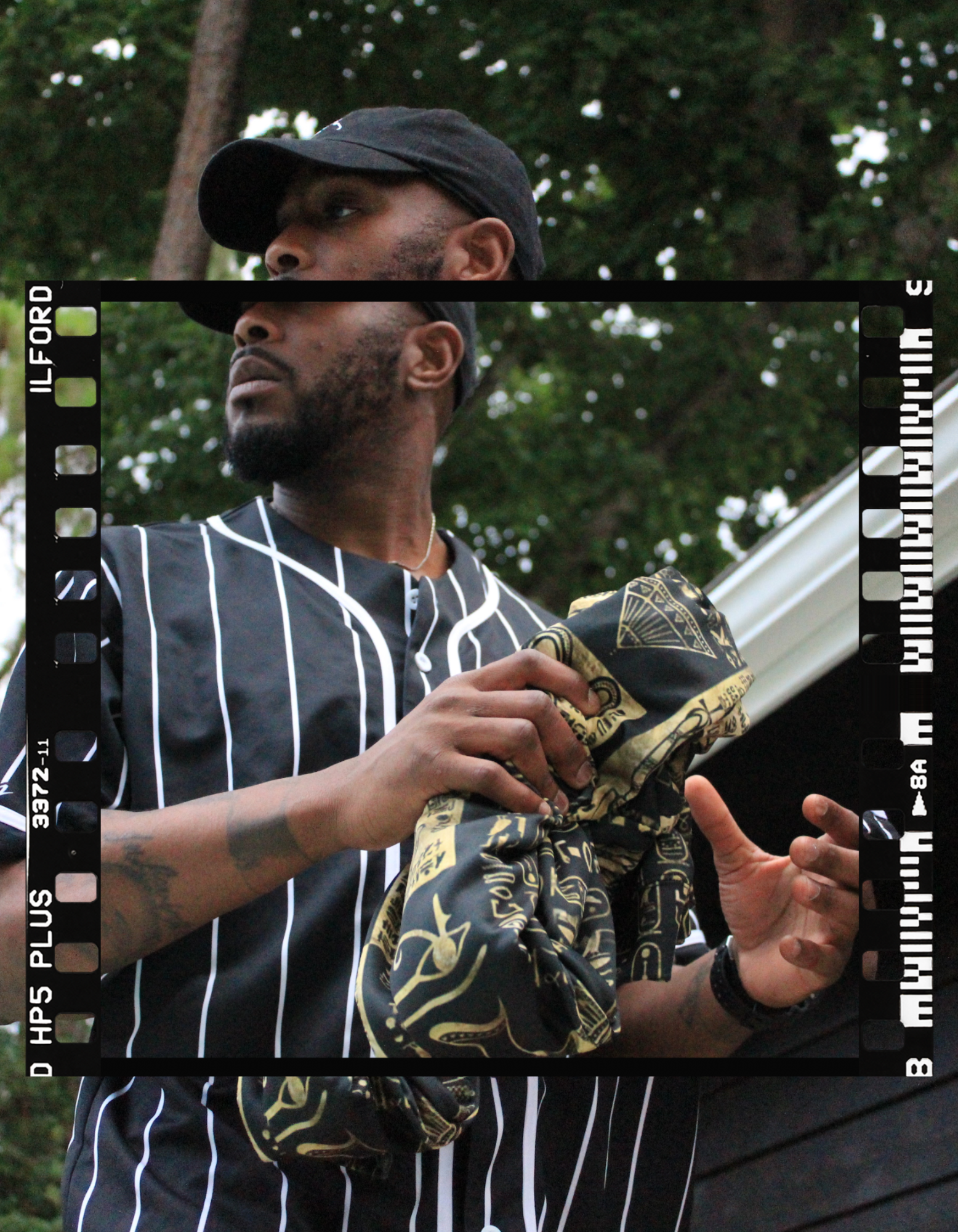 Summer Static Pinstripe Frame graphic — film-frame portrait in pinstripe jersey with gold-print bandana
