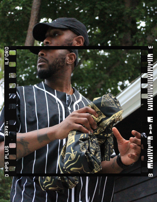 Summer Static Pinstripe Frame graphic — film-frame portrait in pinstripe jersey with gold-print bandana